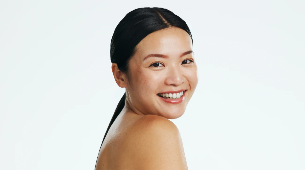 Asian woman, skincare and face of beauty, smile versa featured image