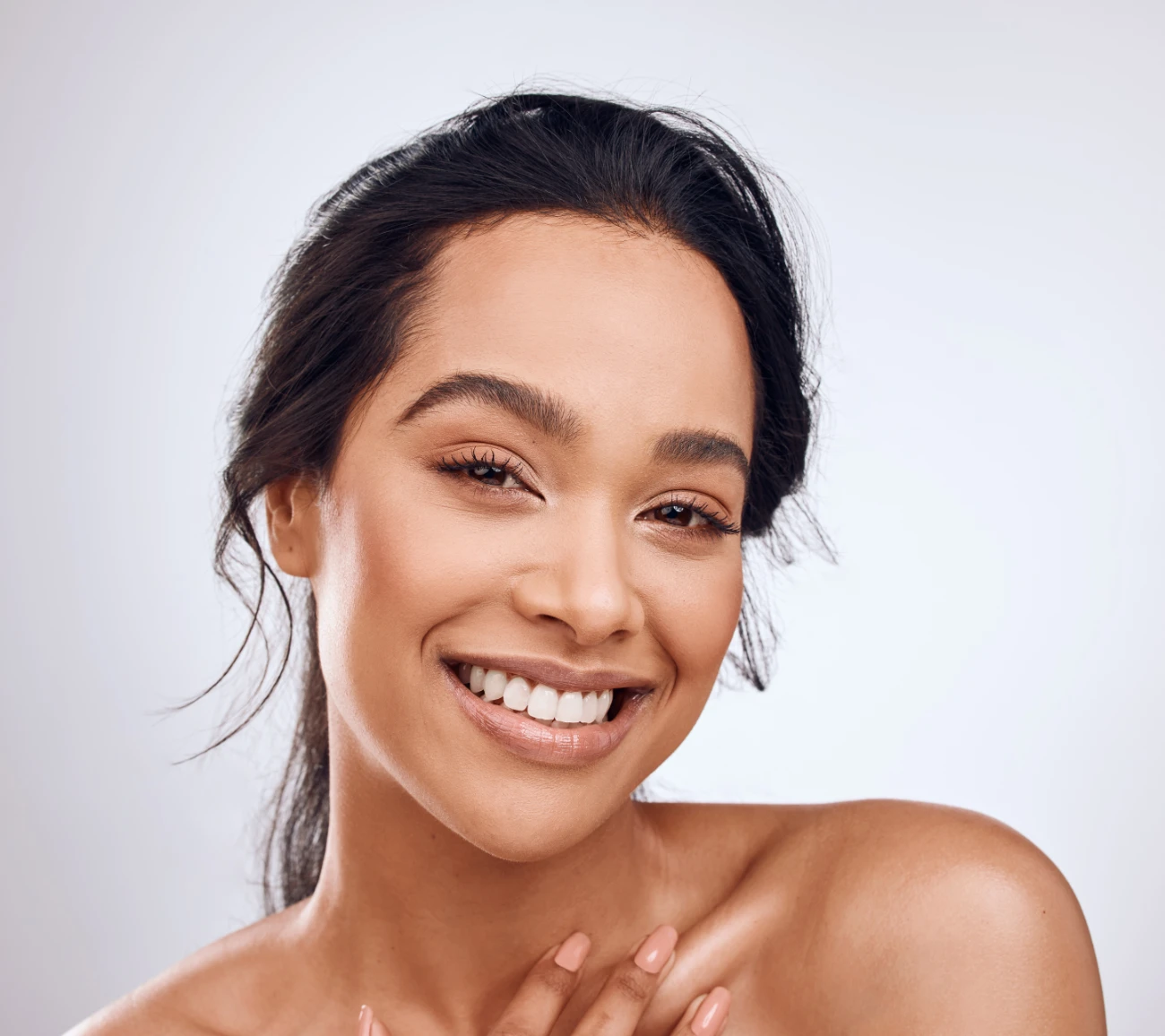 Beauty, skincare and portrait of a happy woman in studio with a smile glow and happiness with cosmetics, makeup and dermatology. radiesse treatment