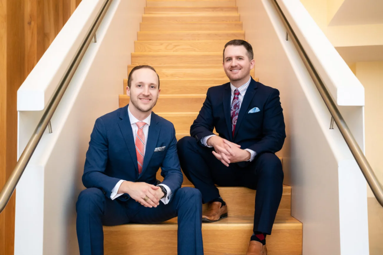 Dr. Cain and Dr. Richardson sitting on stairs