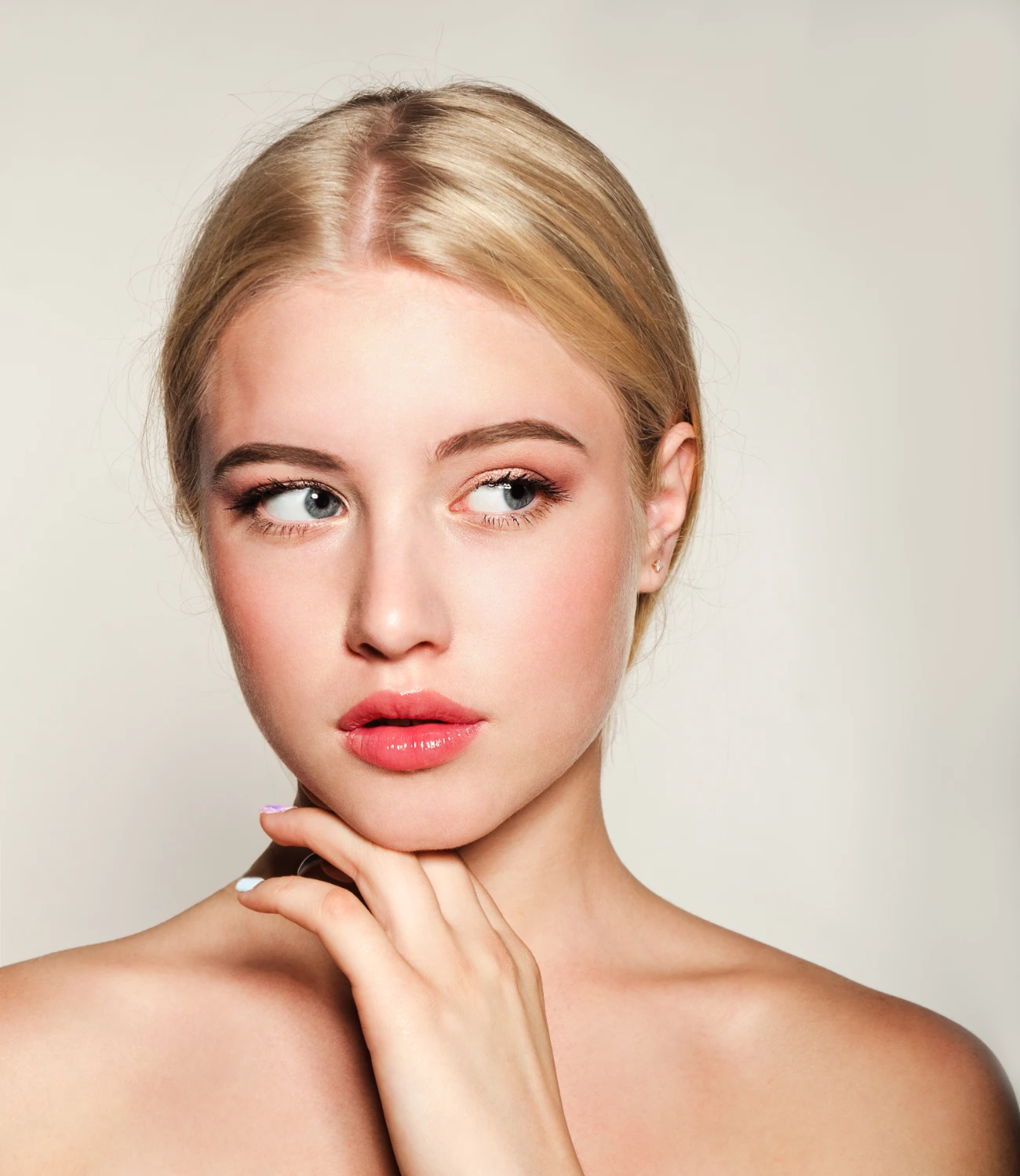 Portrait of beautiful blonde young woman face. Spa model girl with fresh clean skin isolated.