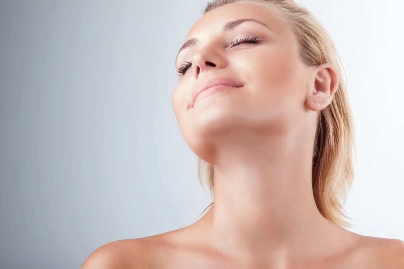 Satisfied woman at spa. neck liposuction