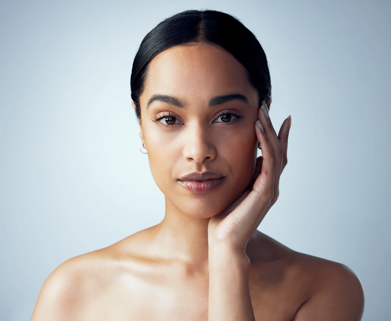 Skincare, portrait and woman in studio for natural, cosmetic and dermatology on grey background. sculptra featured image