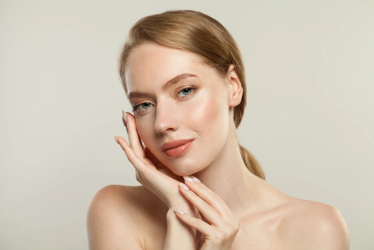 Young healthy woman spa model with clear skin. Skincare, wellness and facial treatment concept Young healthy woman spa model with clear skin. Skincare, wellness and facial treatment concept