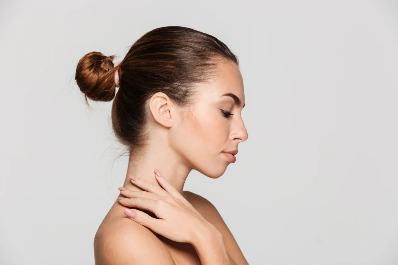 cheek augmentation. Side view beauty portrait of a beautiful half naked woman