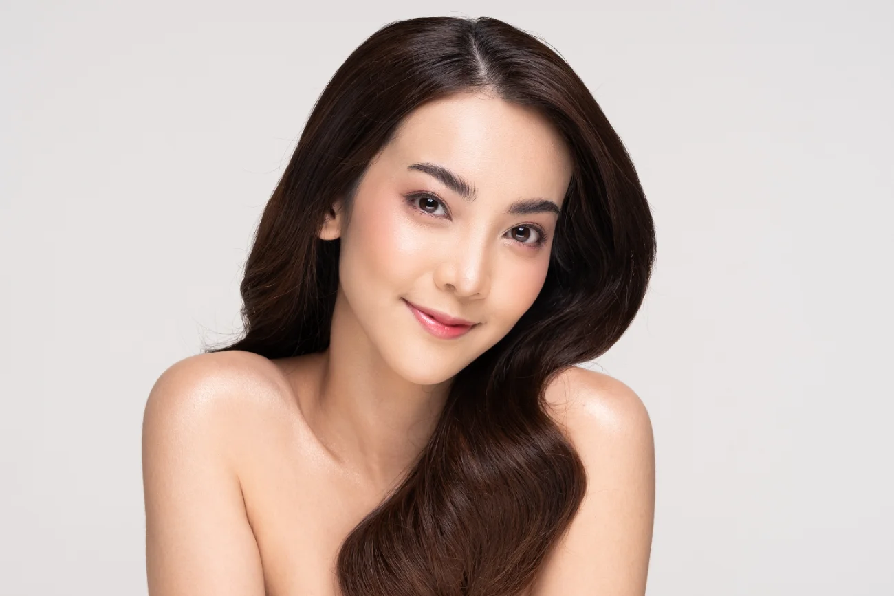 rhinoplasty treatment. Beautiful Asian woman looking at camera smile with clean and fresh skin Happiness and cheerful