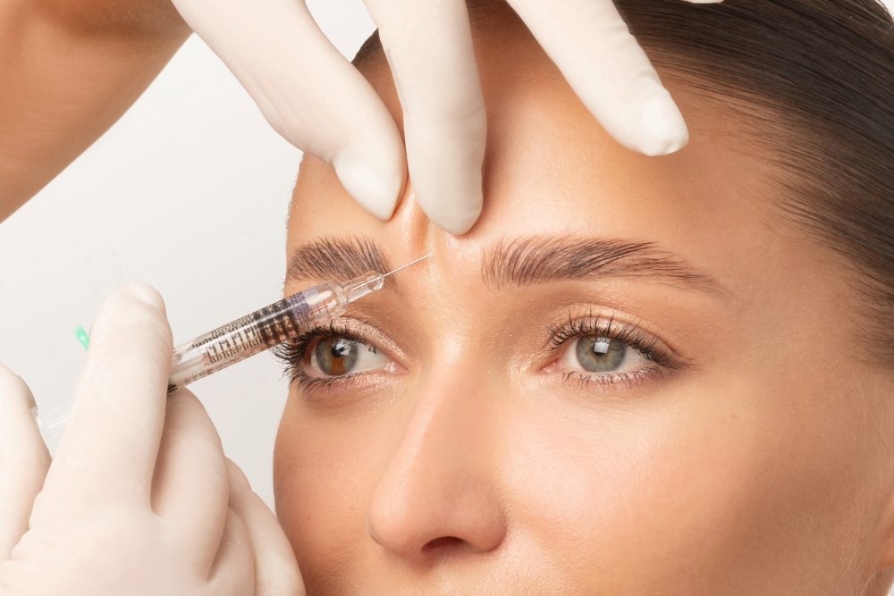 Skincare. Woman with beautiful face touching healthy facial skin.